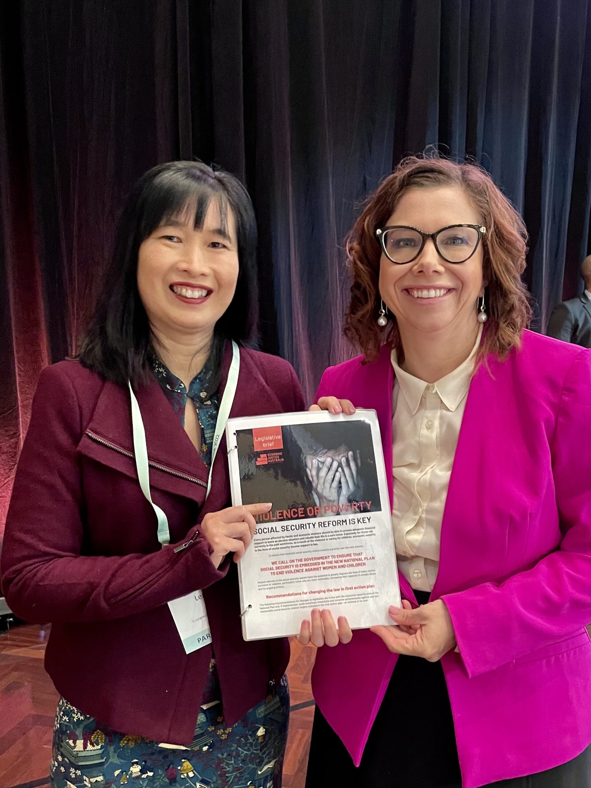 Leanne Ho (Economic Justice Australia) with Minister for Social Services Amanda Rishworth holding the Legislative Brief